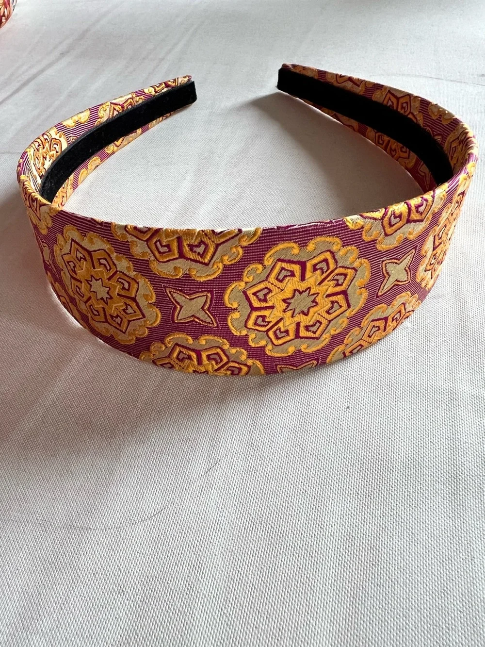 Package of six multi-color and brand headbands.